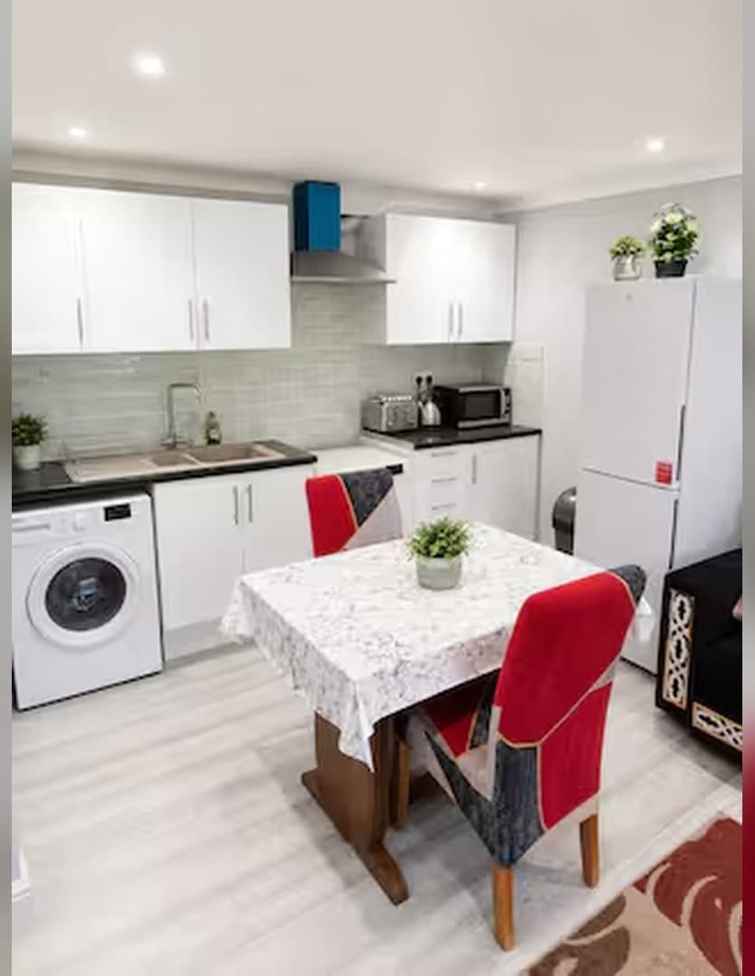 Kitchenette with fridge freezer and dining table