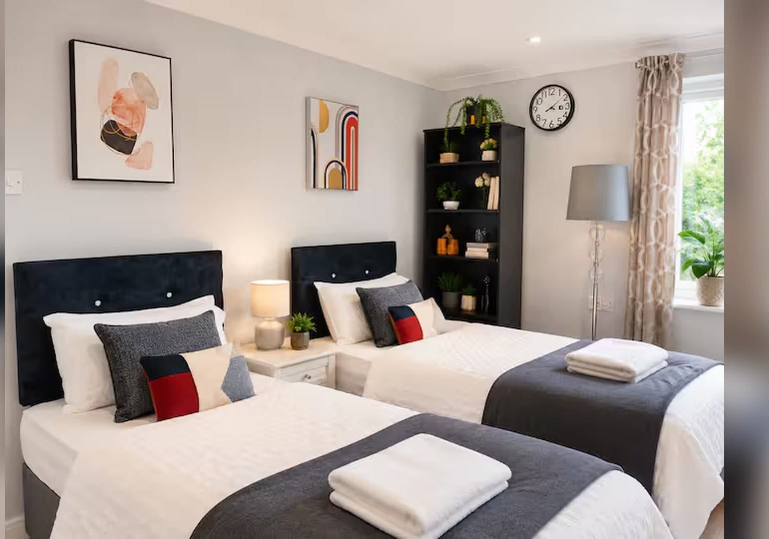 Two comfortable single beds with fresh white linen